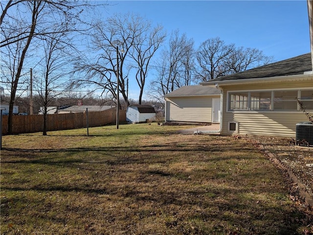 view of yard with cooling unit and a storage shed