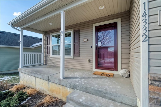 entrance to property featuring a porch