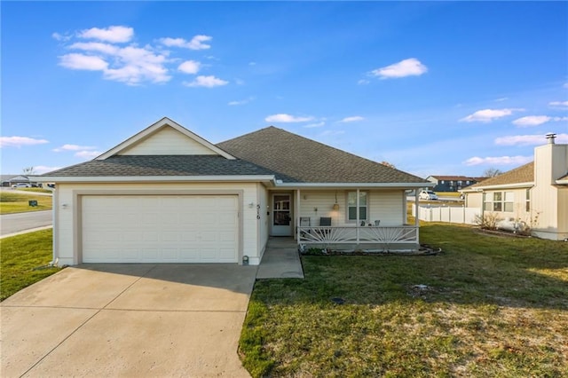 ranch-style house featuring covered porch, a garage, and a front lawn