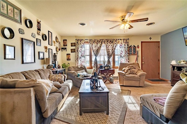 carpeted living room featuring ceiling fan