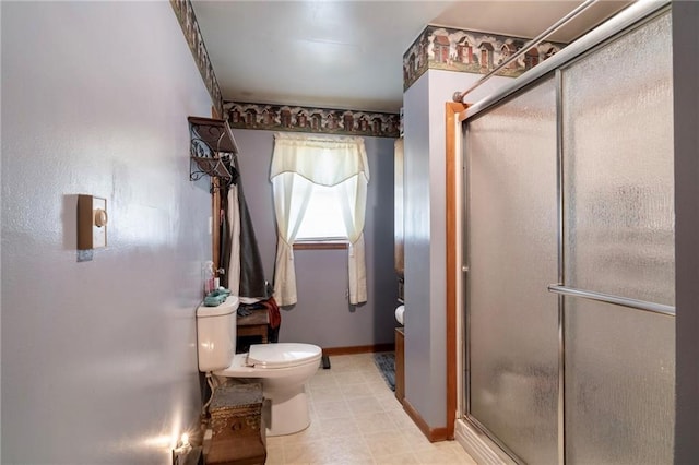 bathroom with toilet and an enclosed shower