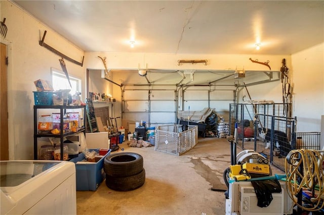 garage with washer / dryer and a garage door opener