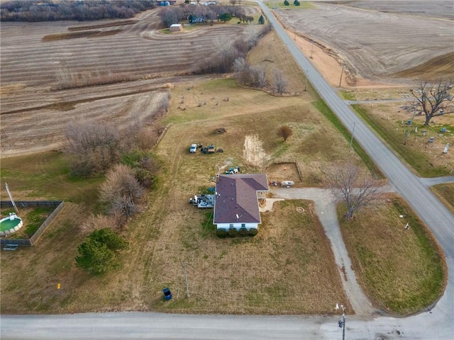 birds eye view of property with a rural view