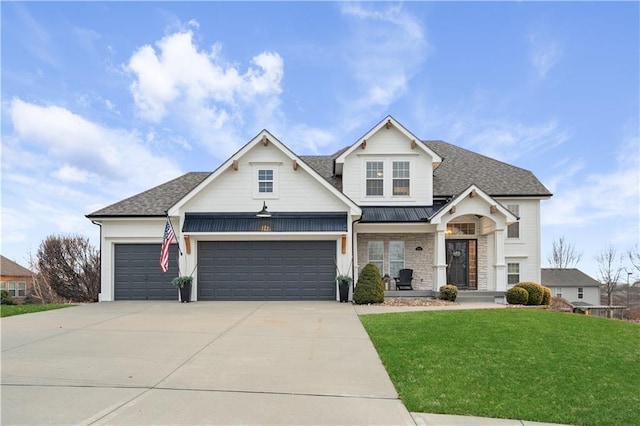 view of front facade featuring a front lawn and a garage