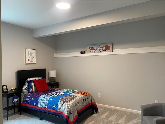 carpeted bedroom featuring baseboards