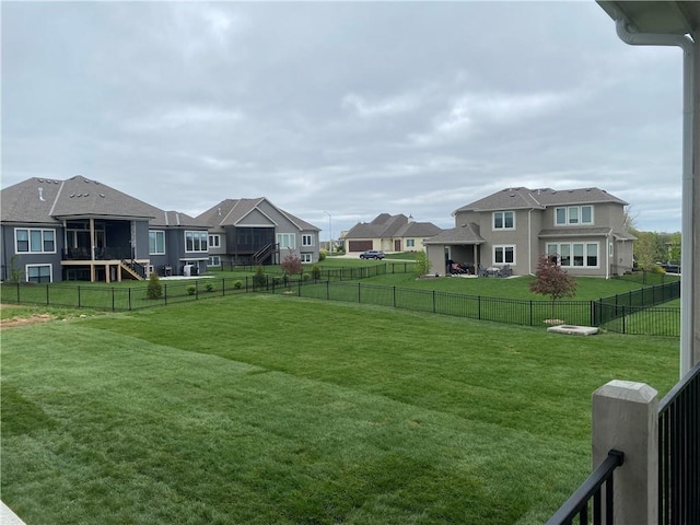 view of yard featuring a residential view and a fenced backyard