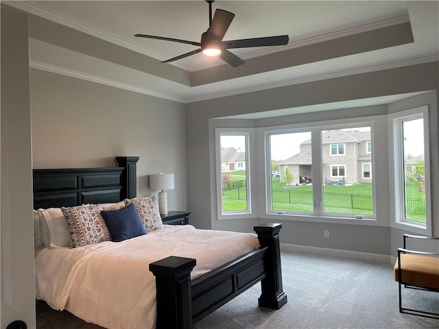 bedroom with ornamental molding, multiple windows, carpet floors, and baseboards