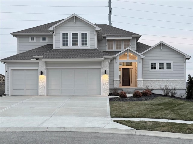 view of front facade with a garage and a front lawn