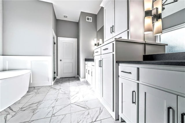 bathroom with a tub to relax in