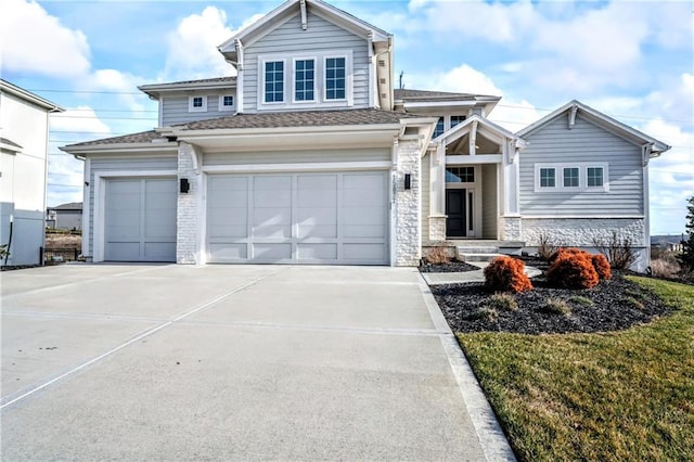 view of front of house with a garage and a front lawn