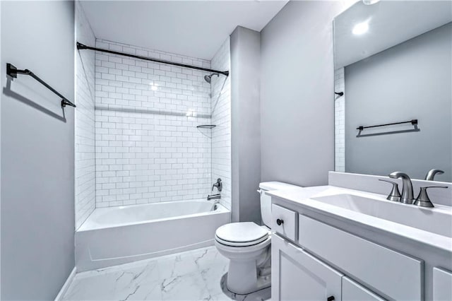 full bathroom with vanity, toilet, and tiled shower / bath