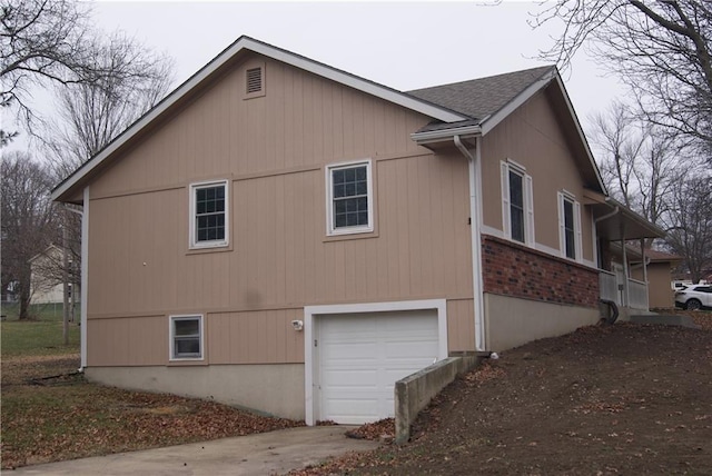 view of side of home featuring a garage