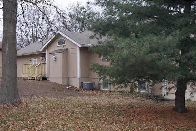 view of property exterior with central AC