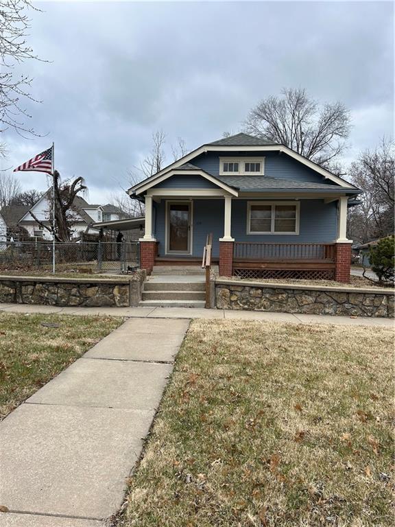 view of front of house with a front lawn and a porch