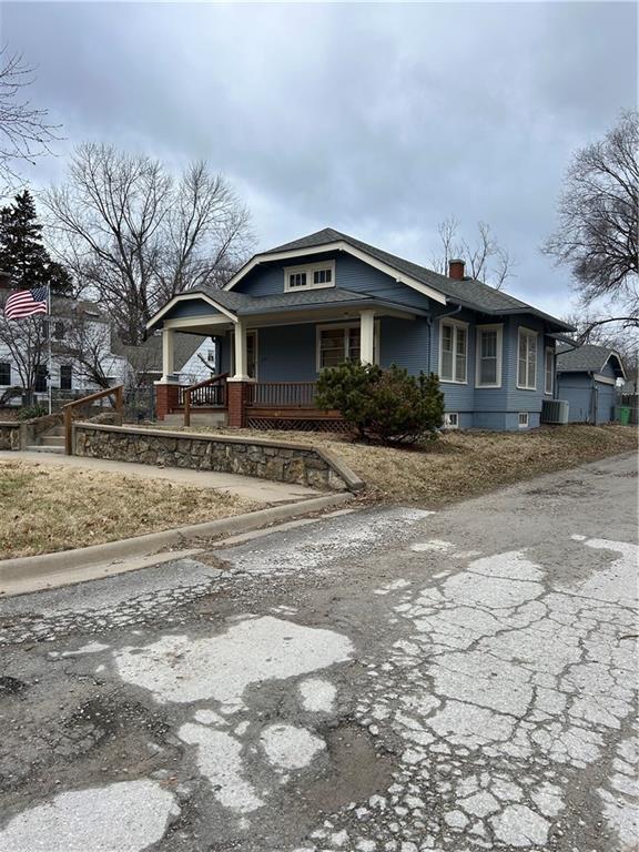 view of front of property featuring covered porch and central AC unit