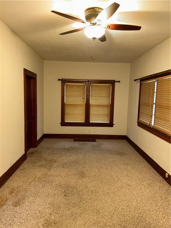 spare room with ceiling fan