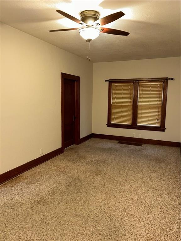 unfurnished room featuring ceiling fan