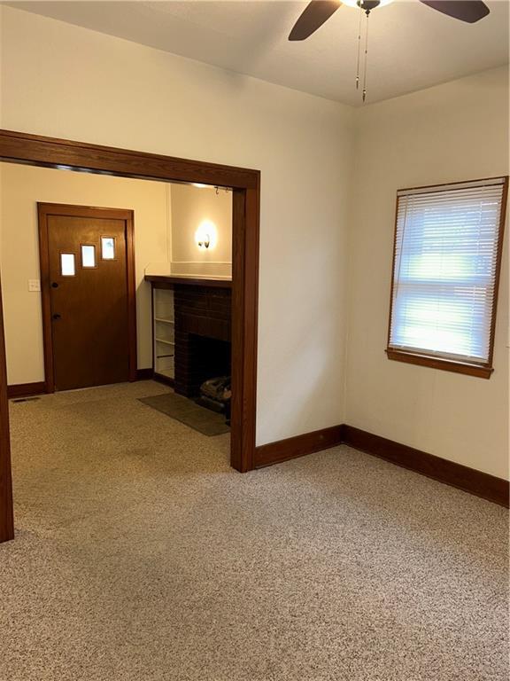 interior space featuring ceiling fan