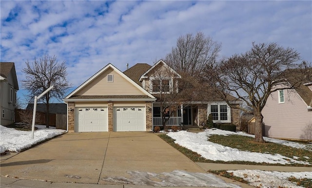 view of front of house featuring a garage and a porch