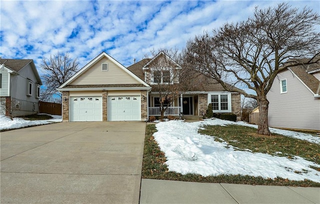 front facade featuring a garage and covered porch