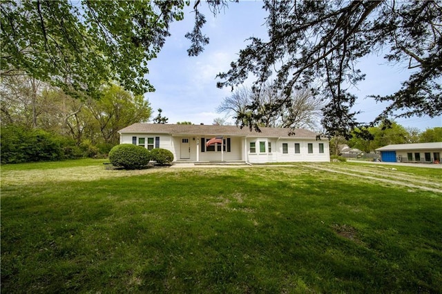 312 Main St, Stilwell, KS 66085 - view of front facade featuring a front lawn