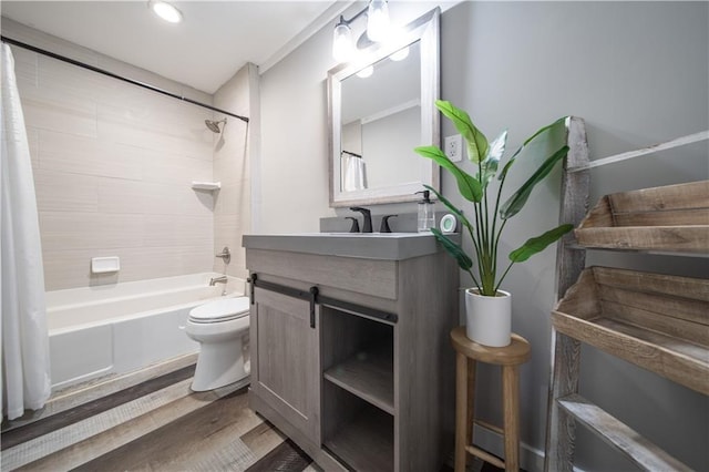 full bathroom featuring hardwood / wood-style flooring, vanity, toilet, and shower / bath combo with shower curtain