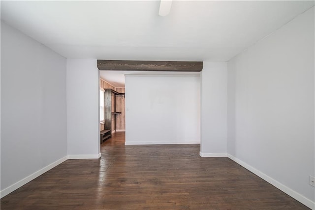 unfurnished room with dark wood-type flooring