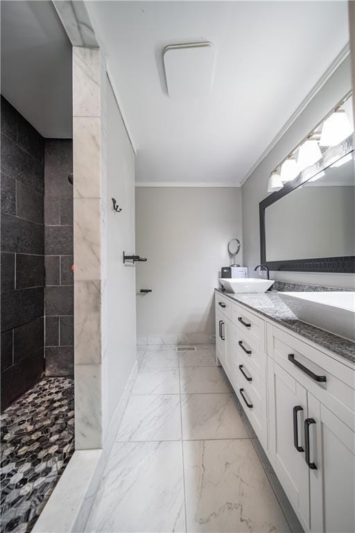 bathroom featuring vanity, a shower, and crown molding