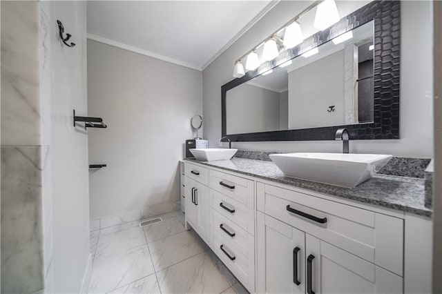 bathroom with crown molding and vanity