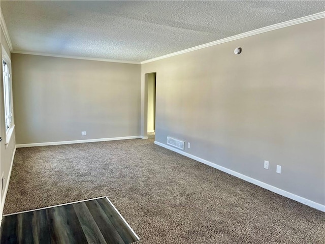 carpeted empty room with crown molding and a textured ceiling