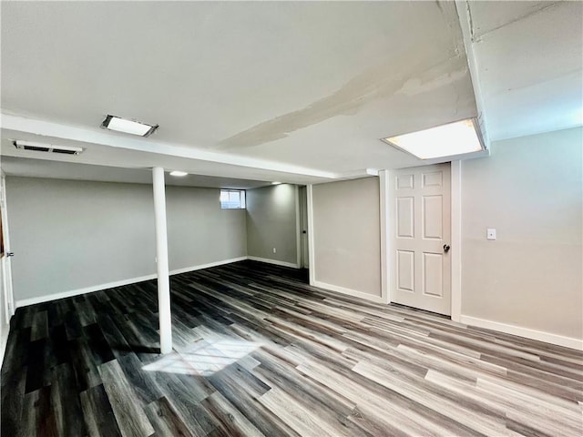 basement with hardwood / wood-style floors