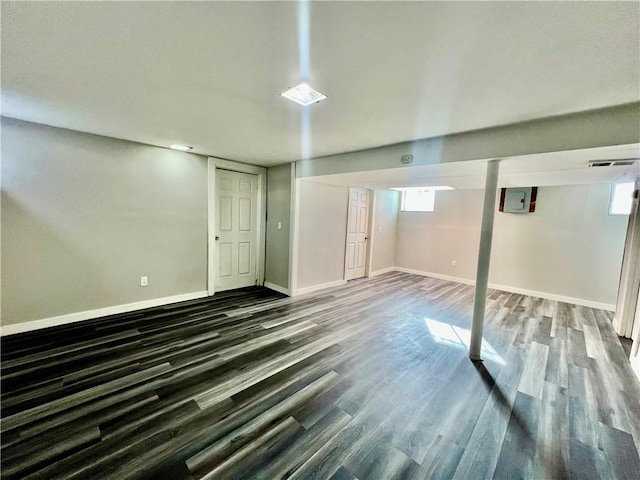 basement featuring dark hardwood / wood-style floors