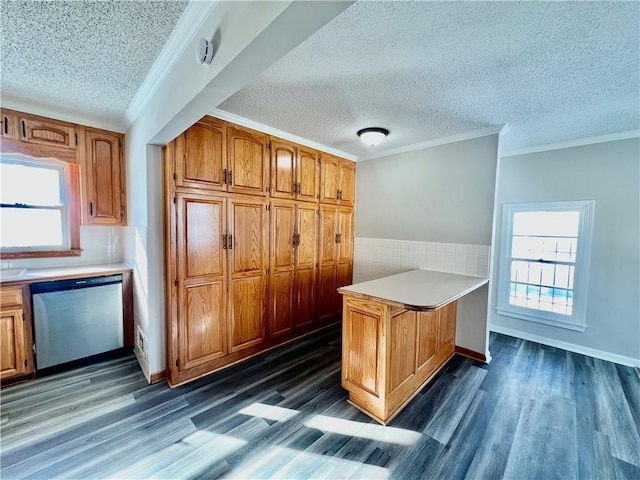 kitchen with kitchen peninsula, dishwasher, dark hardwood / wood-style flooring, and ornamental molding