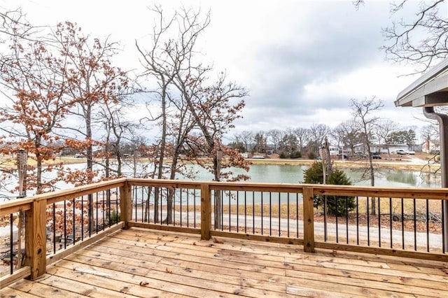 wooden deck featuring a water view