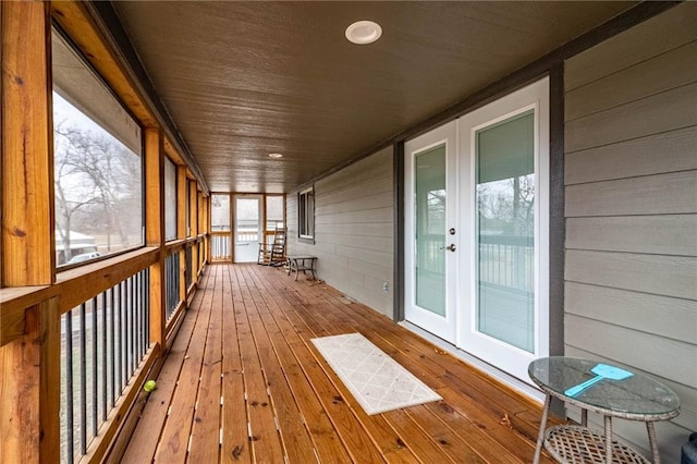 unfurnished sunroom featuring wooden ceiling