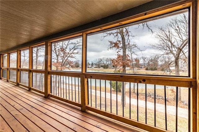 unfurnished sunroom featuring wooden ceiling