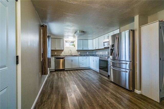 kitchen with sink, white cabinets, and stainless steel appliances