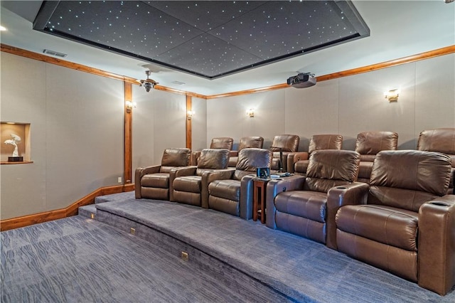 home theater featuring visible vents, carpet, and crown molding
