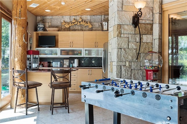 472 N Winnebago Dr, Lake Winnebago, MO 64034 - playroom featuring wooden ceiling, light tile patterned floors, and healthy amount of natural light