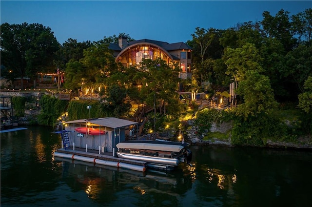 472 N Winnebago Dr, Lake Winnebago, MO 64034 - dock featuring a water view and boat lift