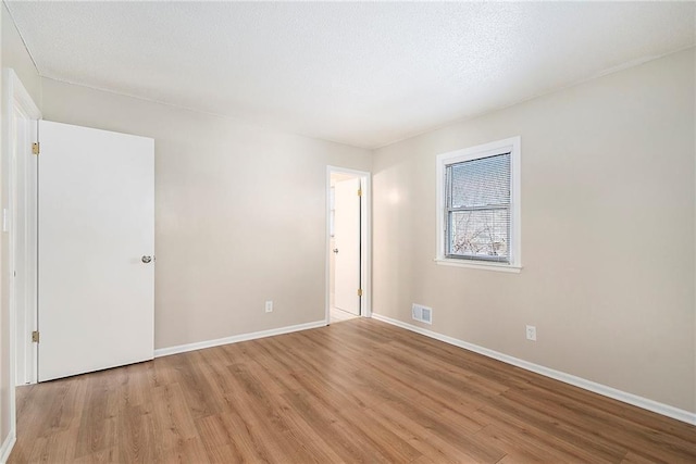 empty room featuring light hardwood / wood-style floors