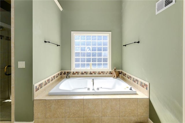 full bath with a garden tub, a shower stall, and visible vents