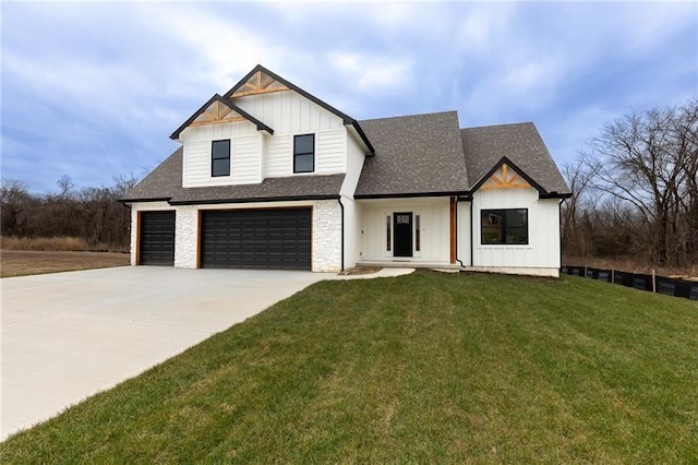 modern inspired farmhouse featuring a garage and a front lawn