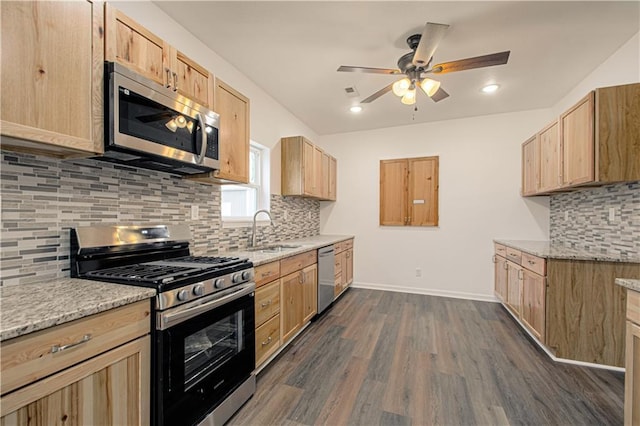 kitchen featuring sink, dark hardwood / wood-style floors, backsplash, light brown cabinetry, and appliances with stainless steel finishes