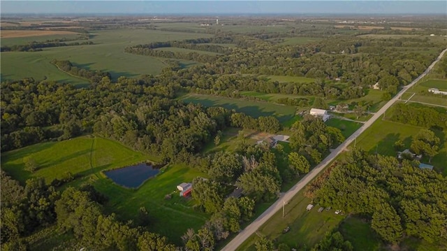 aerial view with a rural view and a water view