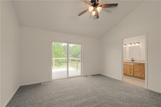 unfurnished bedroom featuring connected bathroom, ceiling fan, light colored carpet, vaulted ceiling, and access to outside