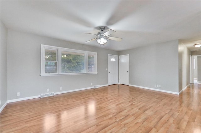 spare room with ceiling fan and light hardwood / wood-style floors