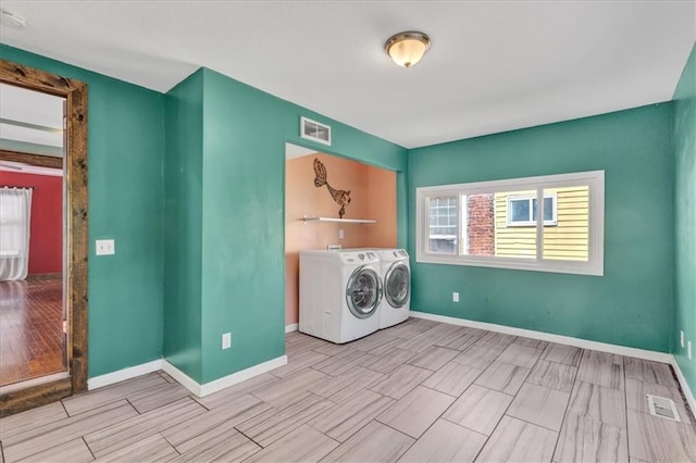 laundry room featuring independent washer and dryer