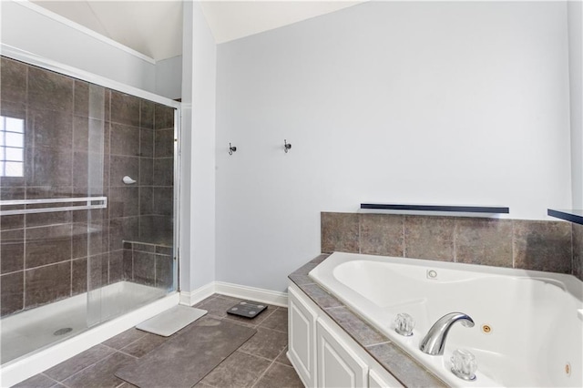 bathroom with tile patterned flooring and independent shower and bath