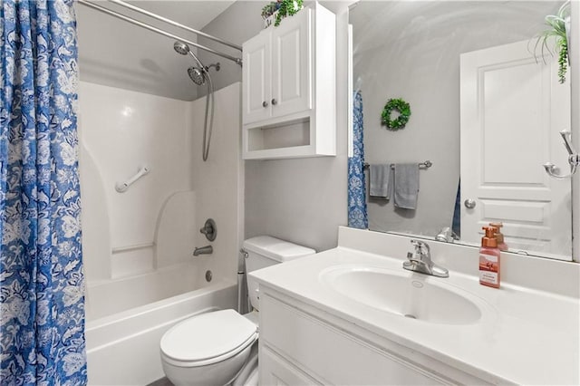 full bathroom with shower / tub combo with curtain, vanity, and toilet